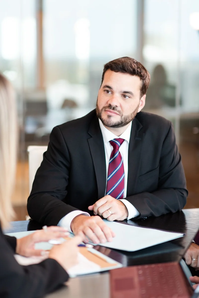 Attorney consulting with client at Delgado Legal P.A.